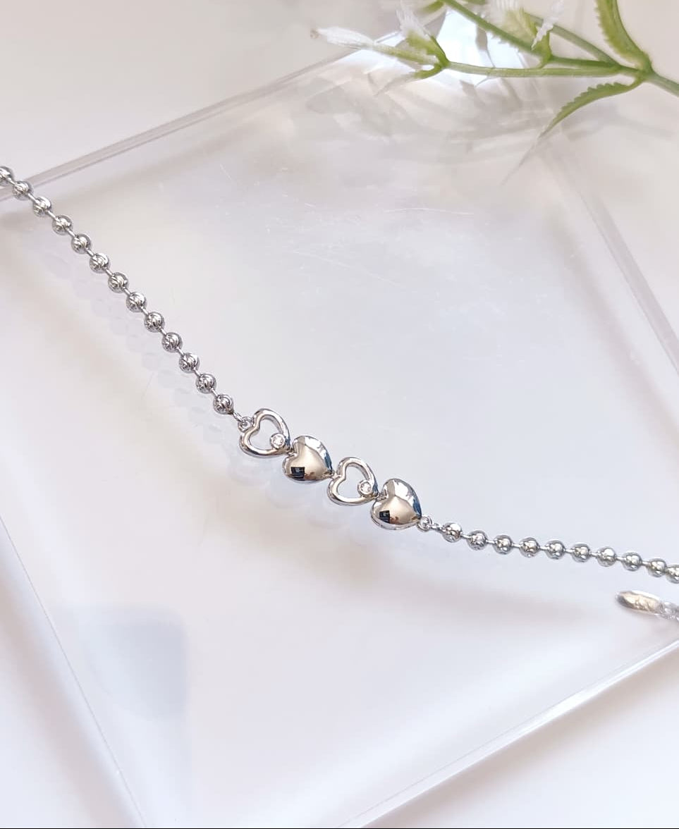 PULSERA CORAZONES PLATEADA