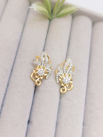 ARETES FLOR ADORNADA PLATEADO Y DORADO