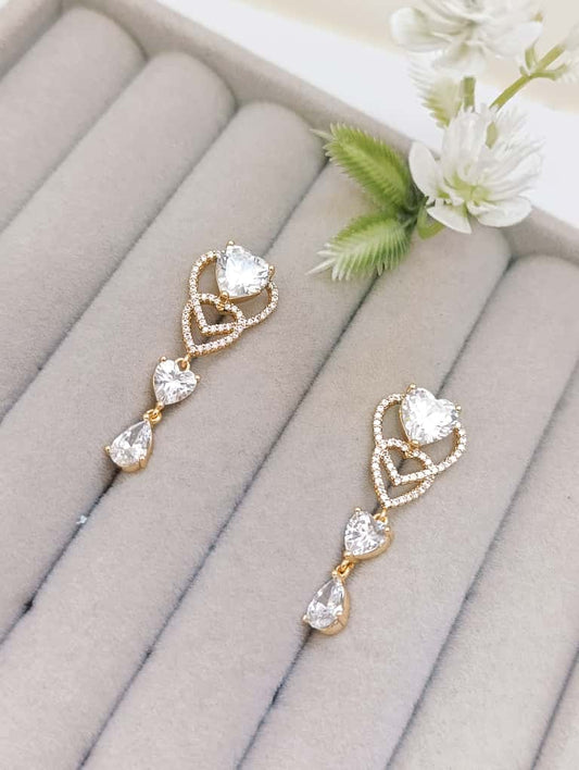 ARETES DORADOS LARGOS CON PIEDRAS